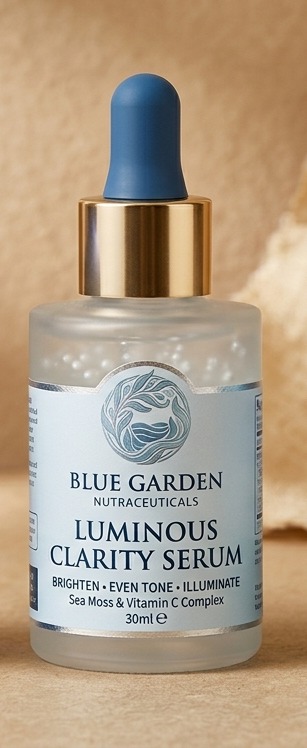 Blue Garden Luminous Clarity Serum in a frosted glass dropper bottle with a brass and blue dropper cap.